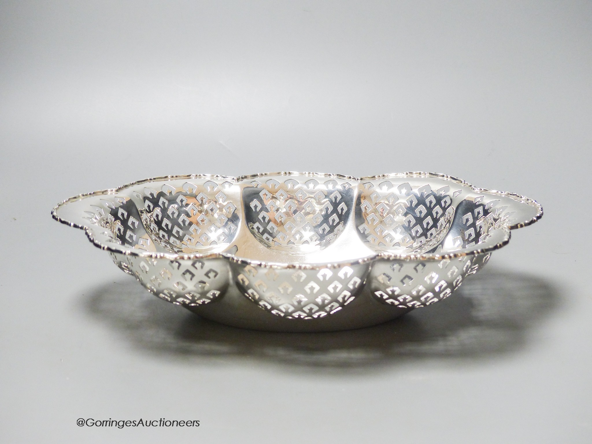 A George V lobed pierced silver oval bowl, Birmingham, 1928, 28.8cm, 12oz.